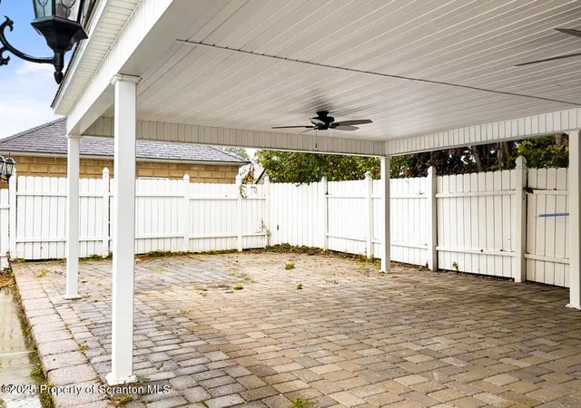 an aerial view of a house with outdoor space
