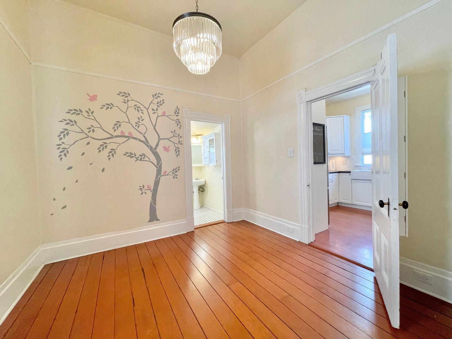 1510 19th Street Sacramento, CA 95811 - Photo 14 of 18 wooden floor in an empty room with a window
