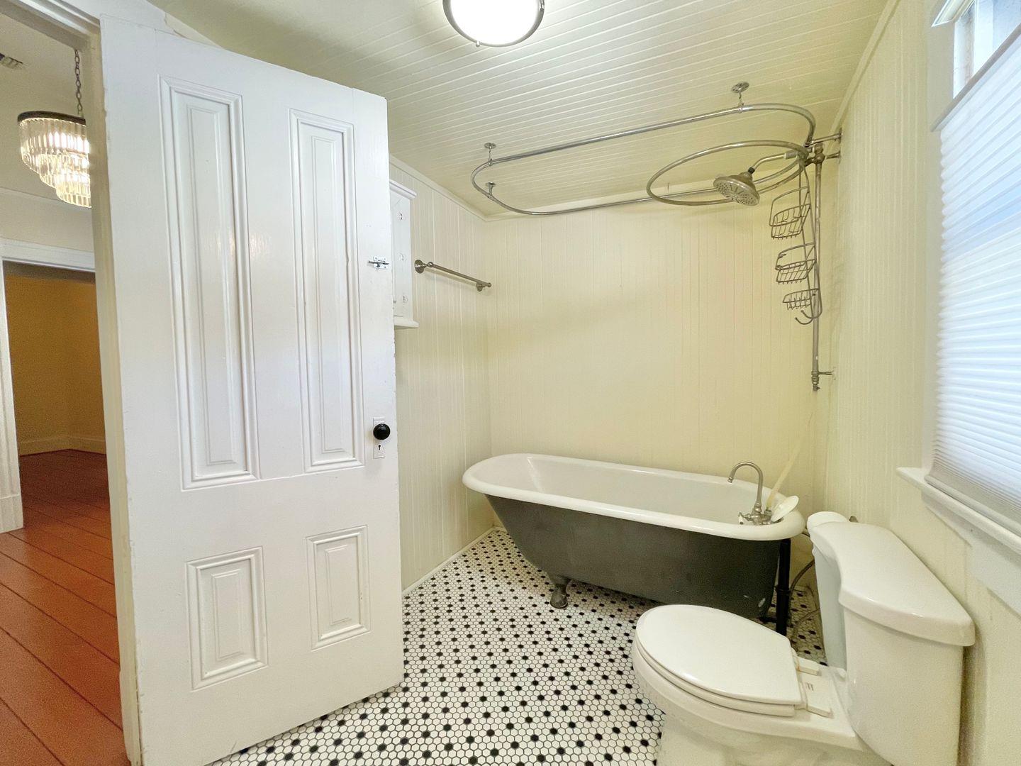 1510 19th Street Sacramento, CA 95811 - Photo 16 of 18 a bathroom with a toilet and a shower