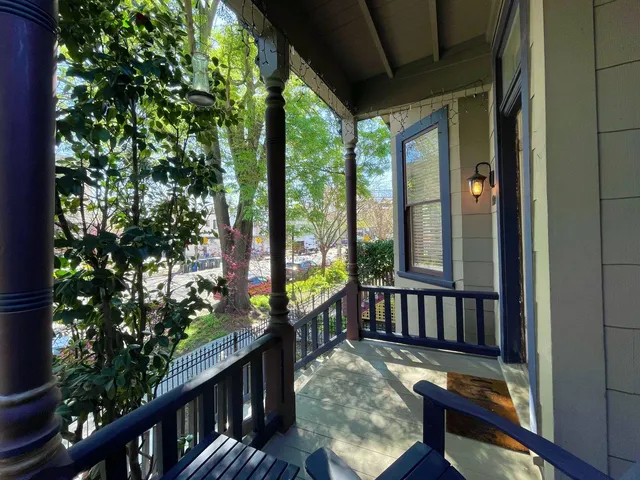 a view of a balcony with furniture