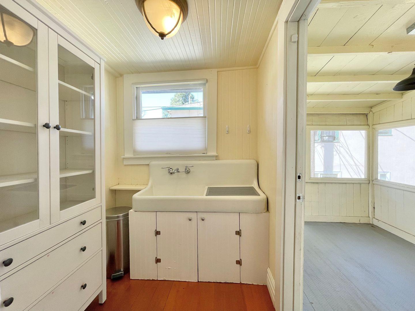 1510 19th Street Sacramento, CA 95811 - Photo 9 of 18 a bathroom with a sink and a mirror