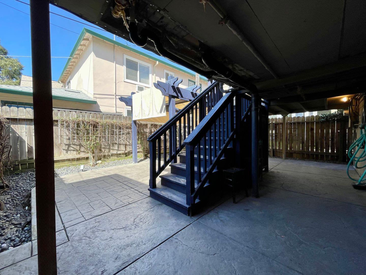 1510 19th Street Sacramento, CA 95811 - Photo 10 of 18 a view of staircase with a large window and wooden floor