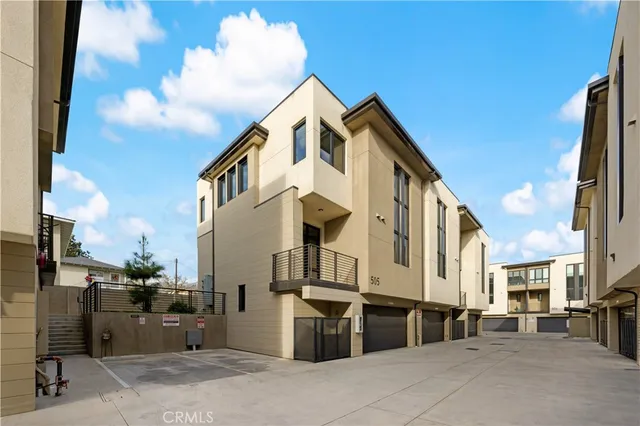 a view of a street with a buildings in the background
