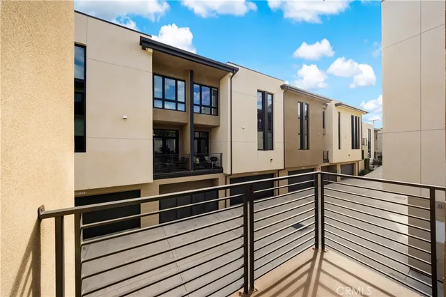 a view of a balcony with furniture