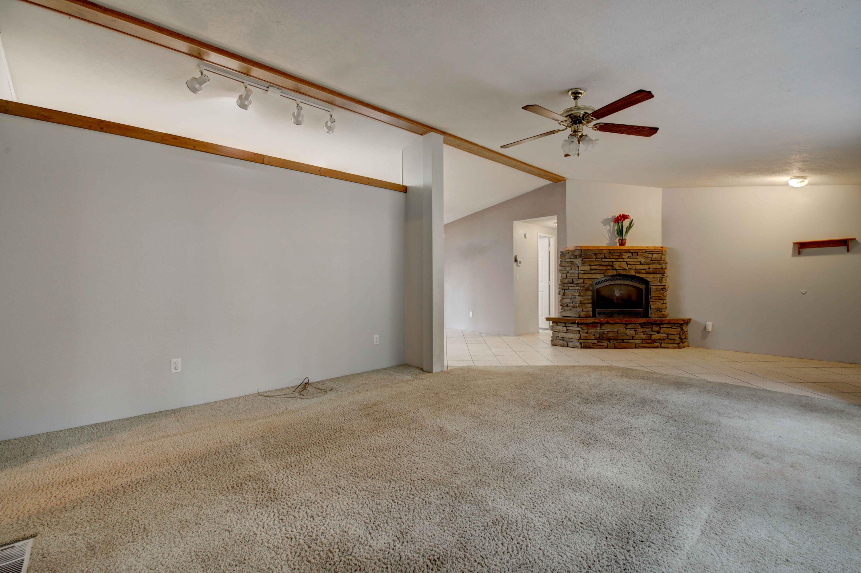 60184 Crater Road Bend, OR 97702 - Photo 5 of 29 Propane fireplace in living room.