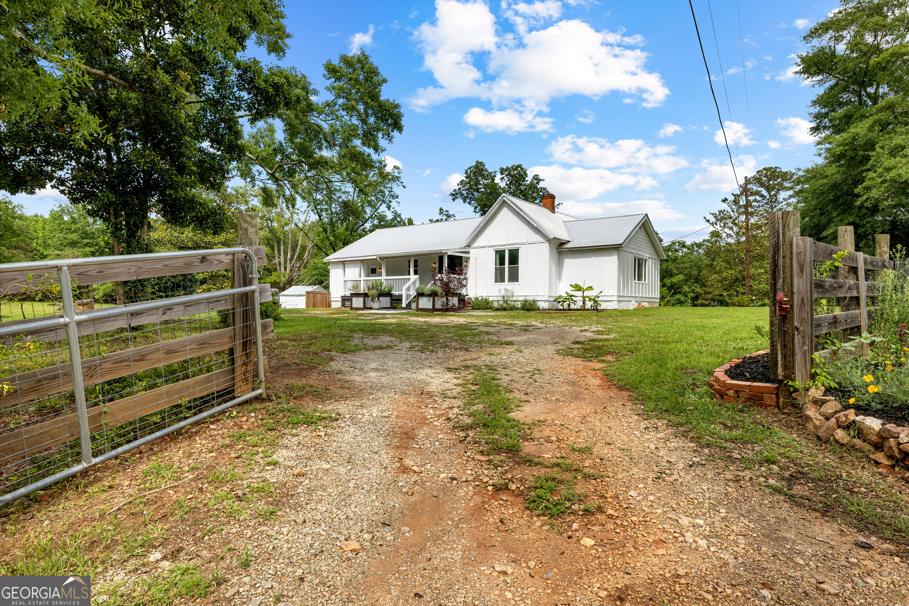 1329 Standing Rock Road Senoia, GA 30276 - Photo 77 of 77 a view of a house with a yard