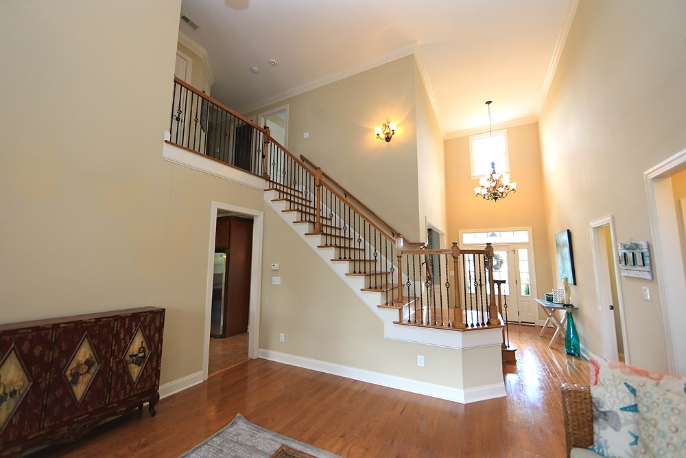 637 Competition Road Raleigh, NC 27603 - Photo 9 of 30 From the Great Room looking back toward the stairs leading to the second floor you can almost imagine your daughter dressed in a formal gown for her first prom making a grand entrance. Great Room