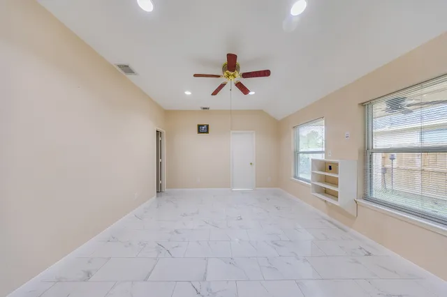 a view of an empty walk in closet