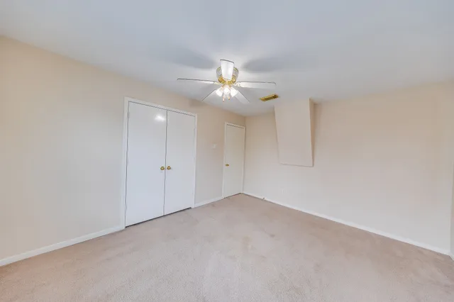 a view of a backyard with a large tree