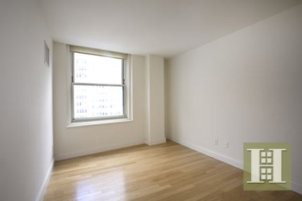 88 Greenwich Street, Unit 2003 Manhattan, NY 10006 - Photo 1 of 4 an empty room with a window