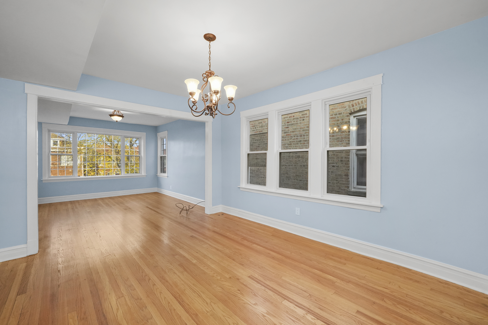 4239 West Melrose Street, Unit 2 Chicago, IL 60641 - Photo 12 of 27 a view of an empty room with wooden floor and a window