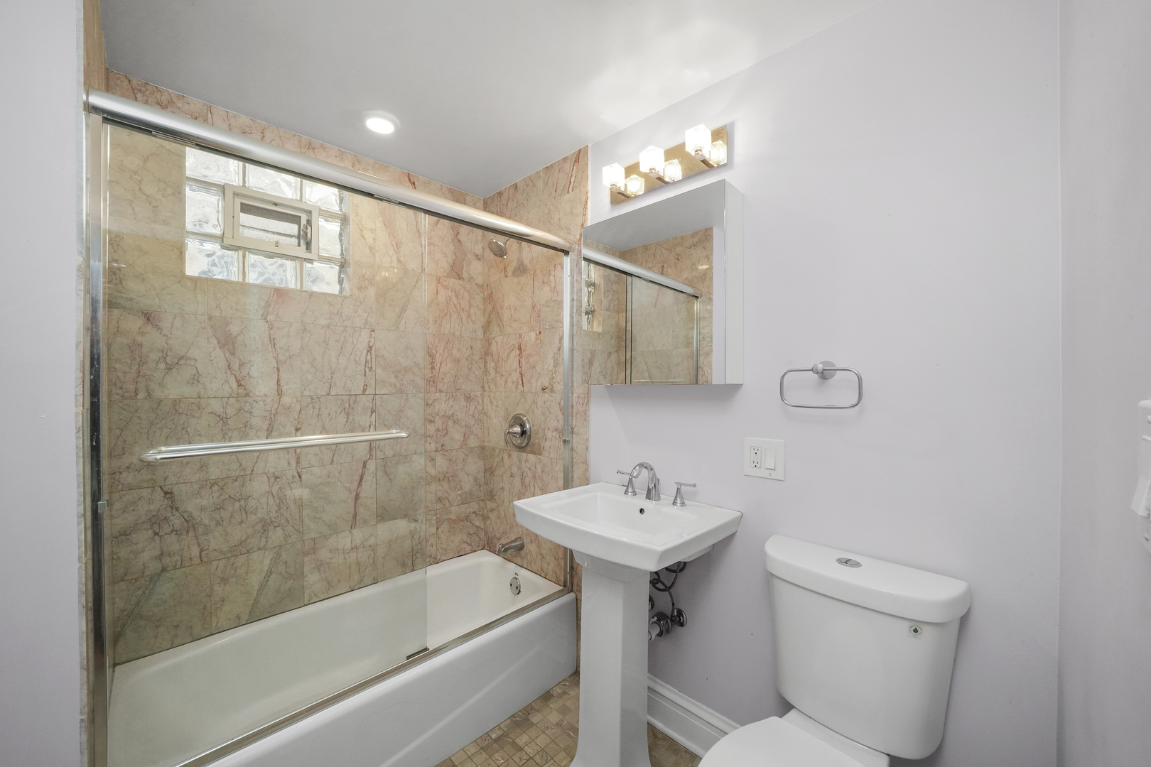 4239 West Melrose Street, Unit 2 Chicago, IL 60641 - Photo 15 of 27 a bathroom with a sink toilet and shower