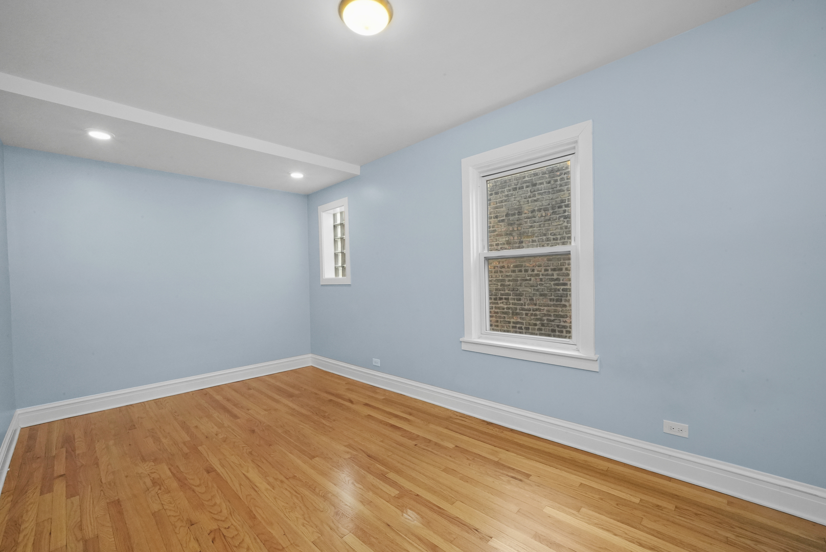 4239 West Melrose Street, Unit 2 Chicago, IL 60641 - Photo 17 of 27 an empty room with a window