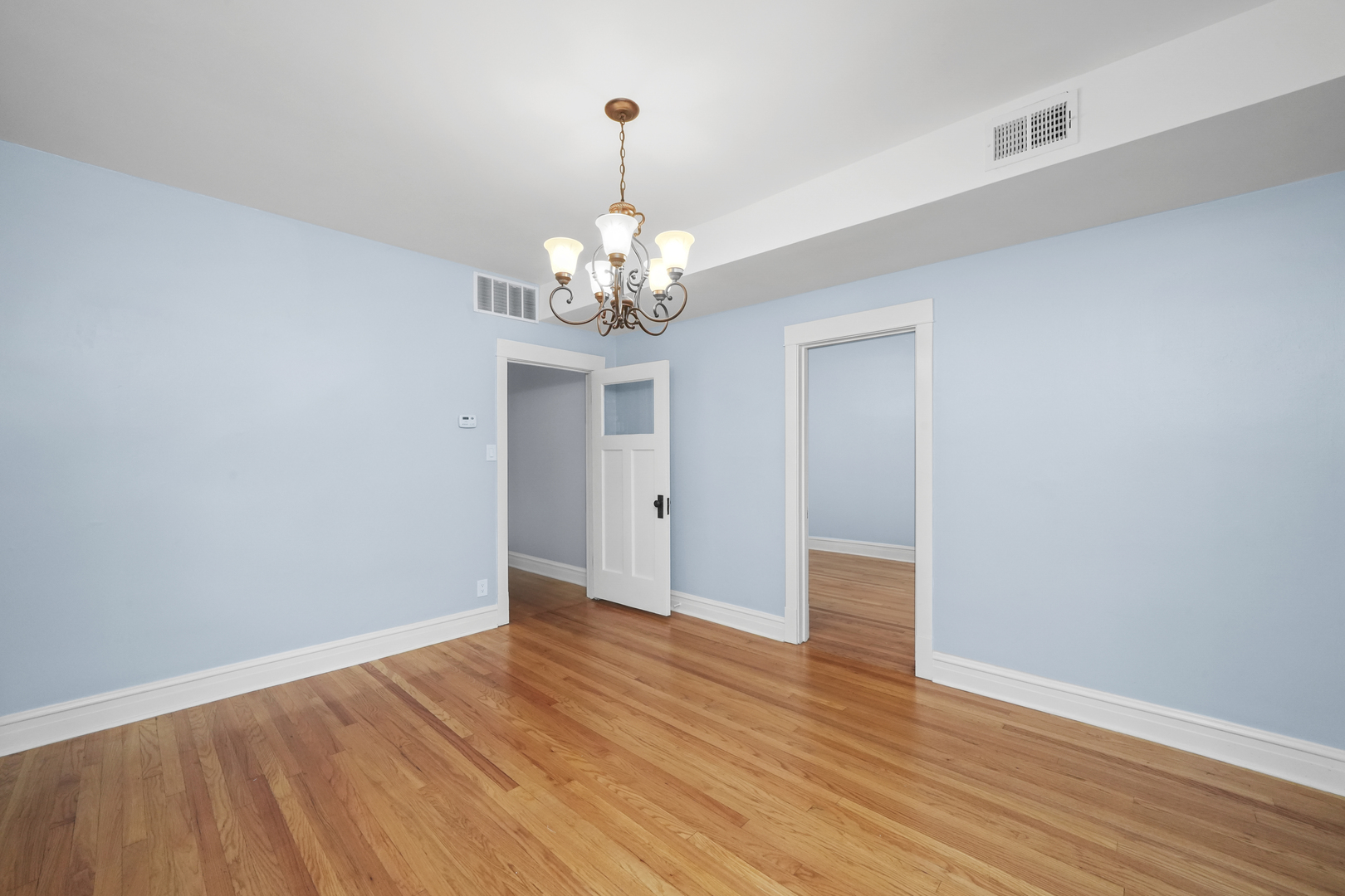 4239 West Melrose Street, Unit 2 Chicago, IL 60641 - Photo 6 of 27 a view of an empty room with wooden floor