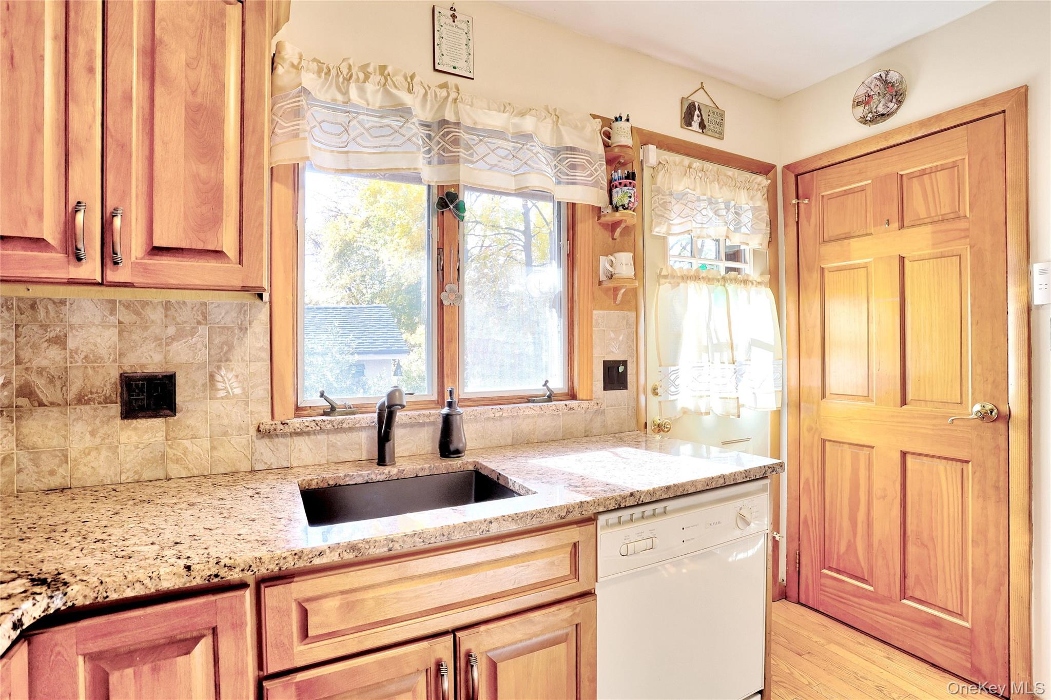 310 South Mountain Road New City, NY 10956 - Photo 12 of 27 a kitchen with stainless steel appliances granite countertop a sink and a window