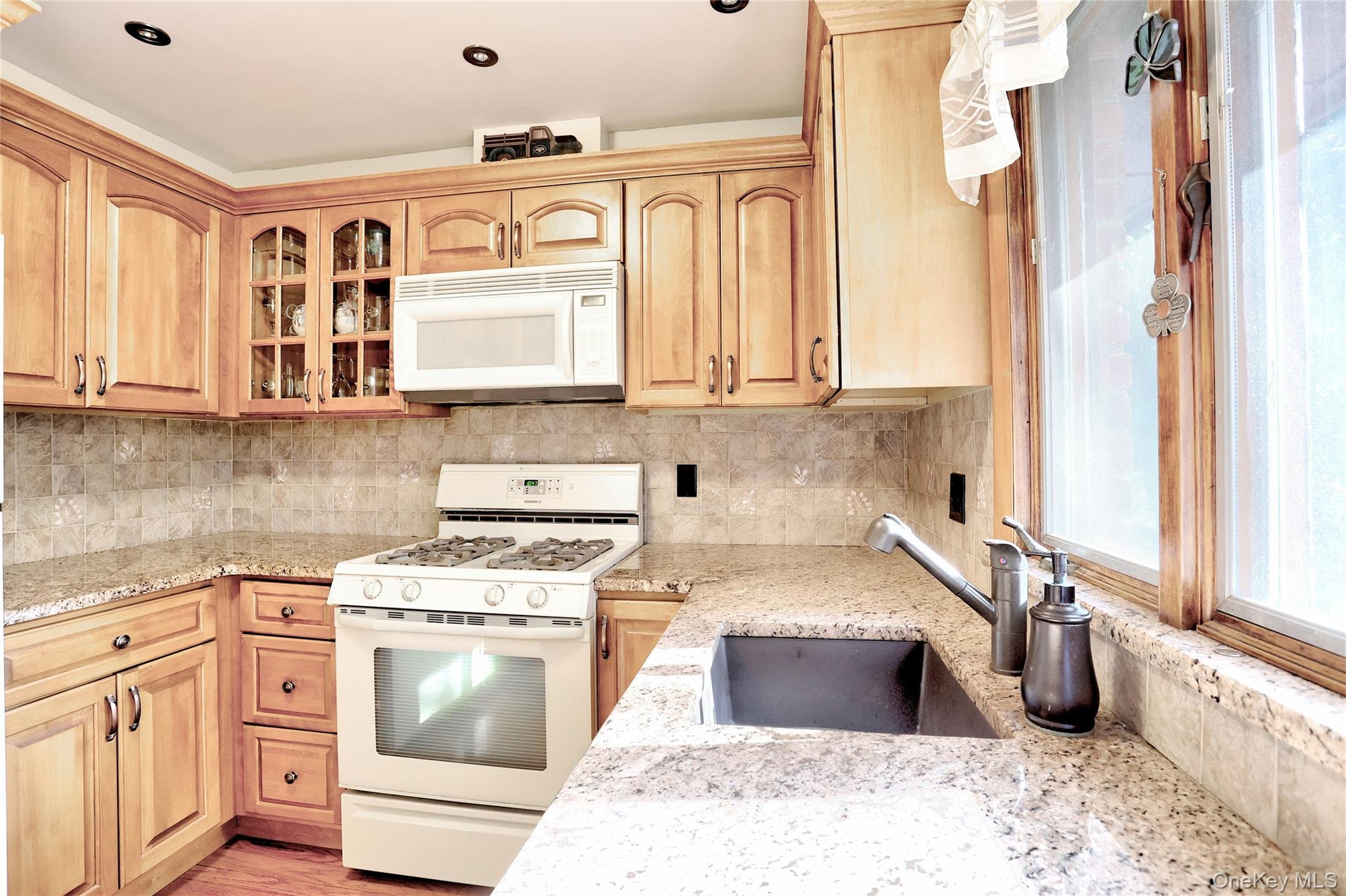 310 South Mountain Road New City, NY 10956 - Photo 12 of 27 a kitchen with stainless steel appliances granite countertop a stove a sink and a microwave