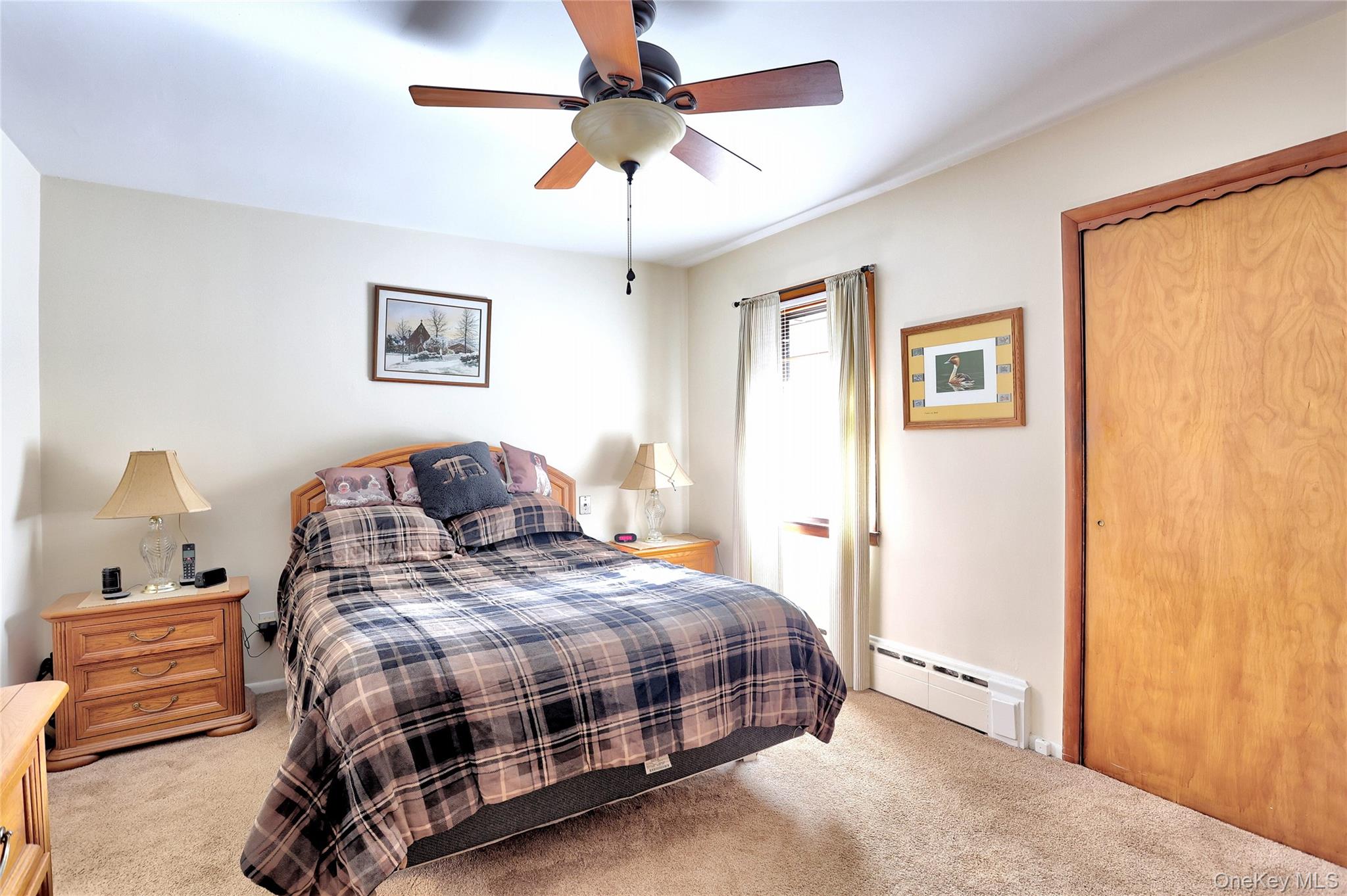 310 South Mountain Road New City, NY 10956 - Photo 14 of 27 a bedroom with a bed and a chandelier