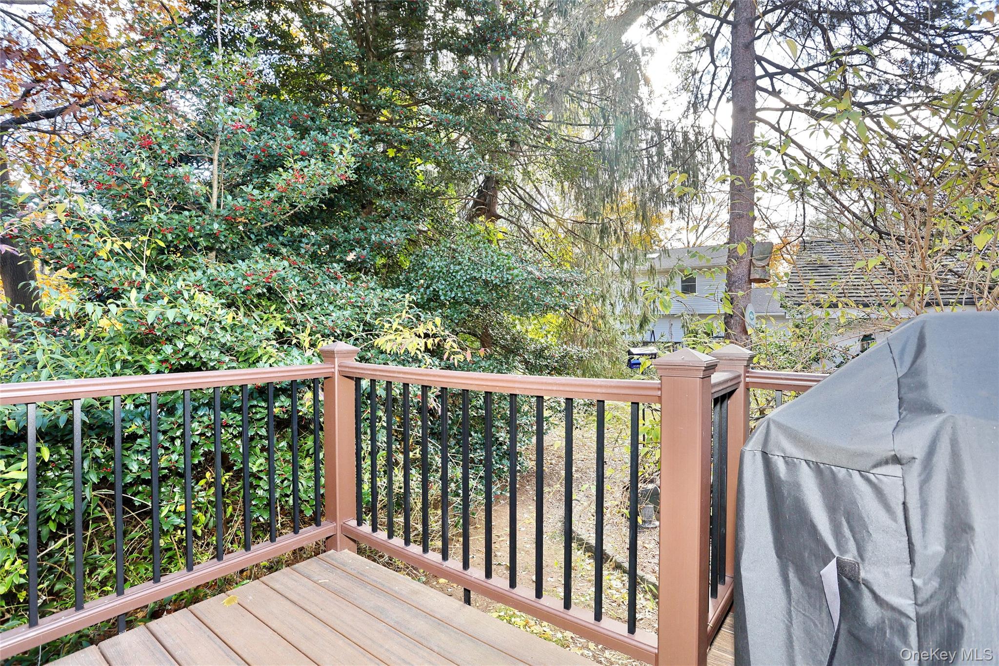 310 South Mountain Road New City, NY 10956 - Photo 18 of 27 a balcony with wooden floor and fence