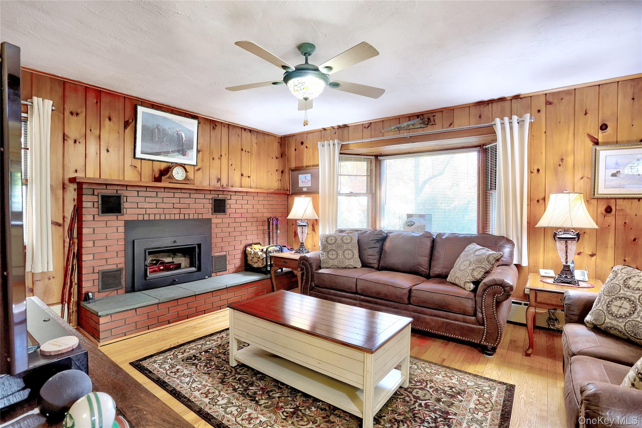 310 South Mountain Road New City, NY 10956 - Photo 7 of 27 a living room with furniture fireplace and a large window