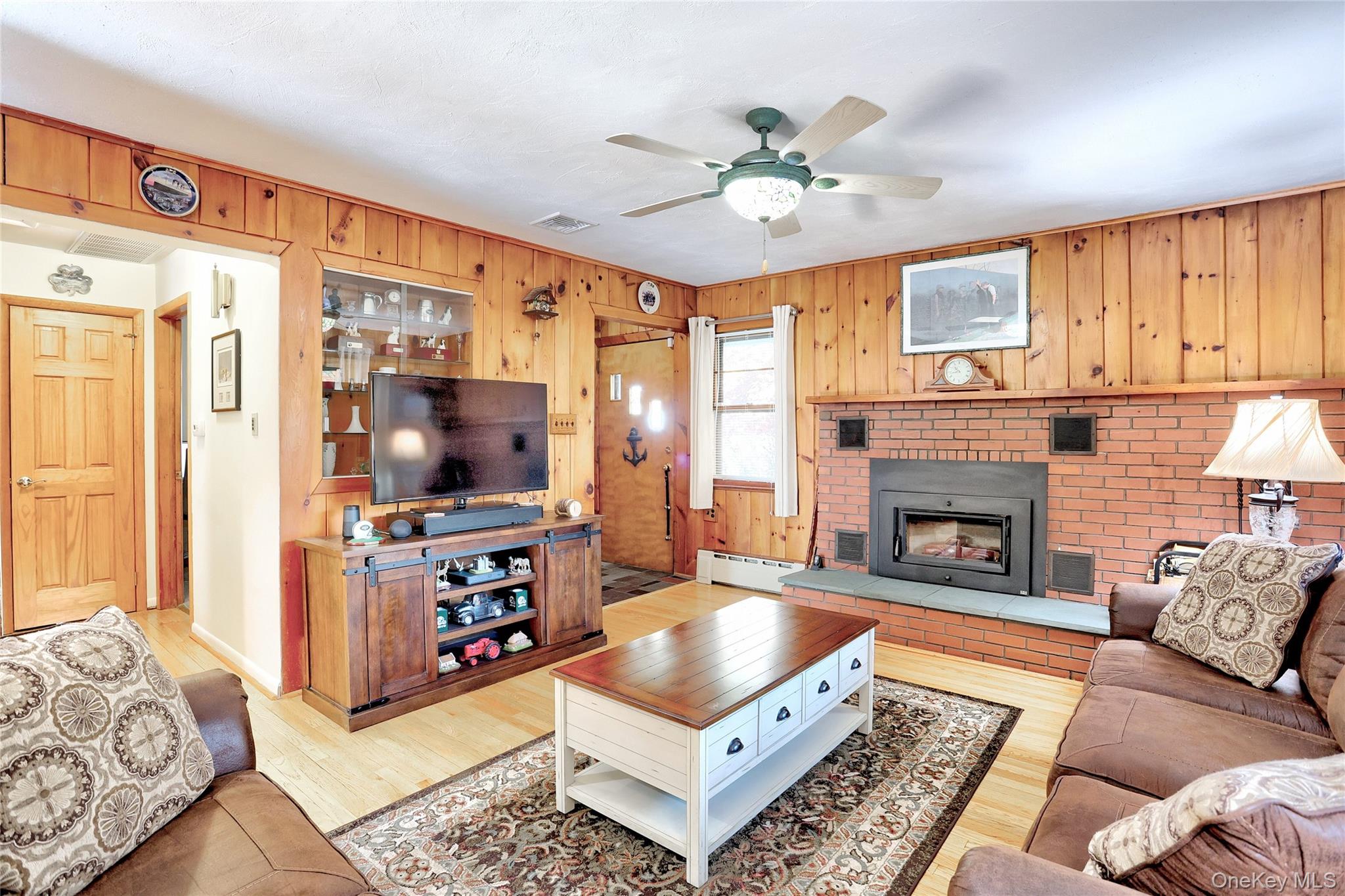 310 South Mountain Road New City, NY 10956 - Photo 8 of 27 a living room with furniture and a flat screen tv