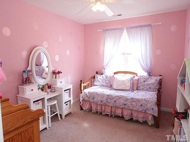 4908 Topstone Road Raleigh, NC 27603 - Photo 11 of 14 a bedroom with a bed and a dresser