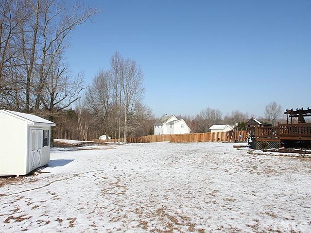 4908 Topstone Road Raleigh, NC 27603 - Photo 12 of 14 a view of a dirt road and a building in the background