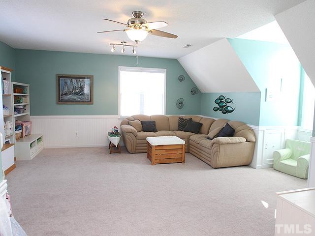 4908 Topstone Road Raleigh, NC 27603 - Photo 9 of 14 a living room with furniture and a window