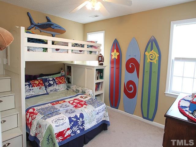 4908 Topstone Road Raleigh, NC 27603 - Photo 10 of 14 a bedroom with a bed and a desk