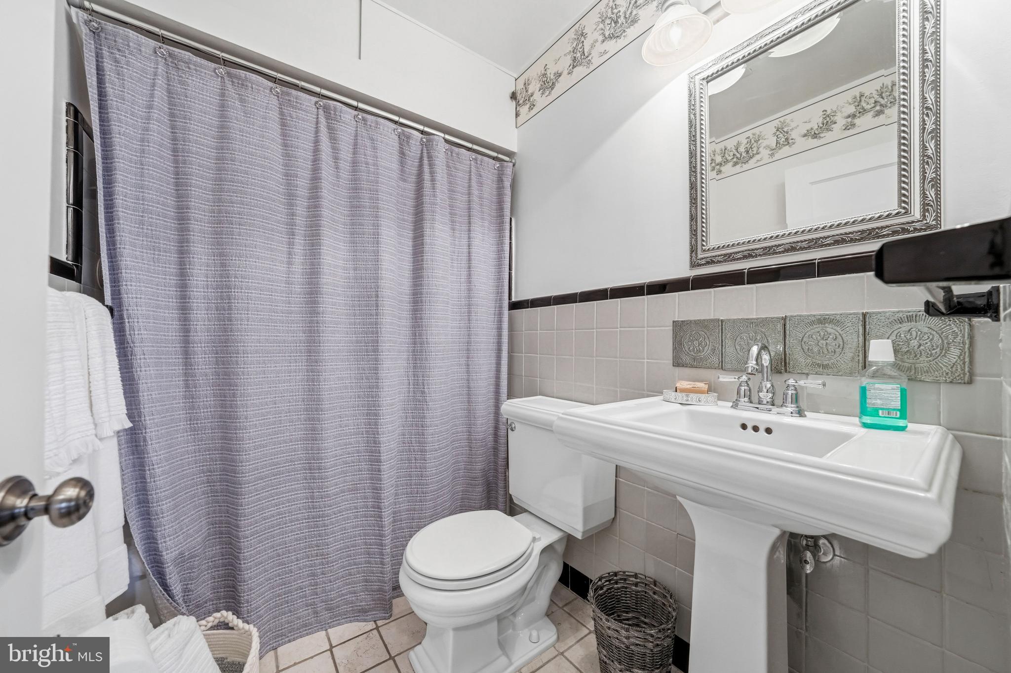 6 Woodbine Avenue Maple Shade, NJ 08052 - Photo 16 of 35 a bathroom with a sink a toilet and mirror