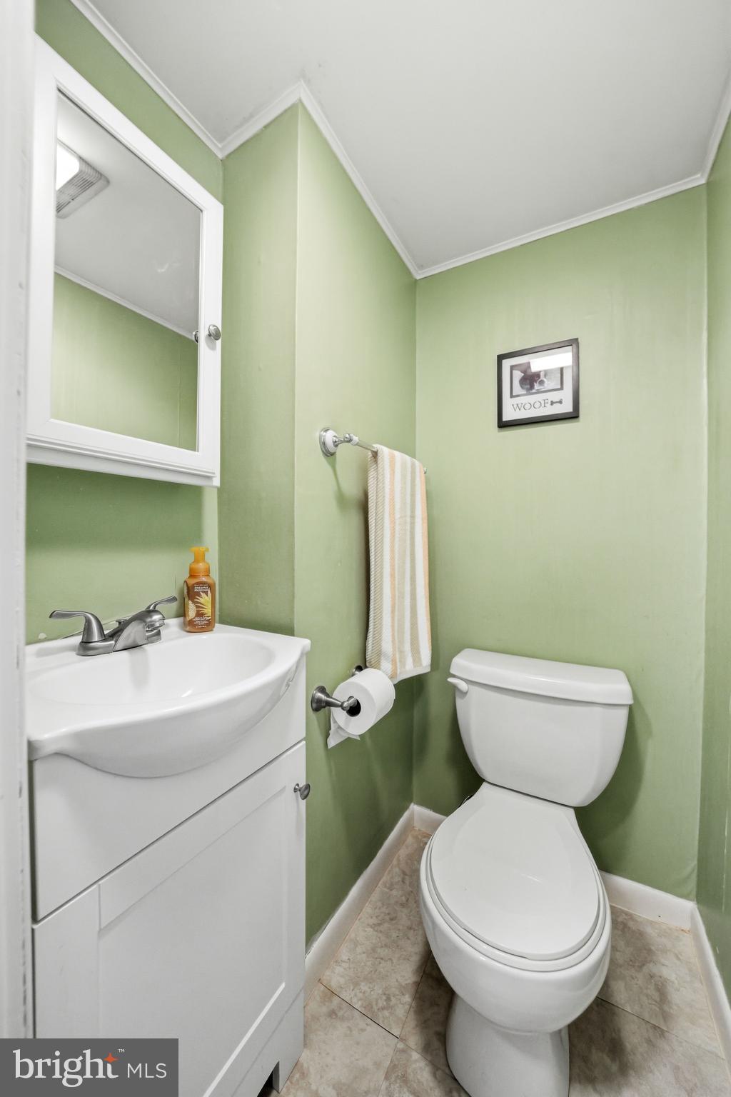 6 Woodbine Avenue Maple Shade, NJ 08052 - Photo 17 of 35 a bathroom with a toilet sink and mirror