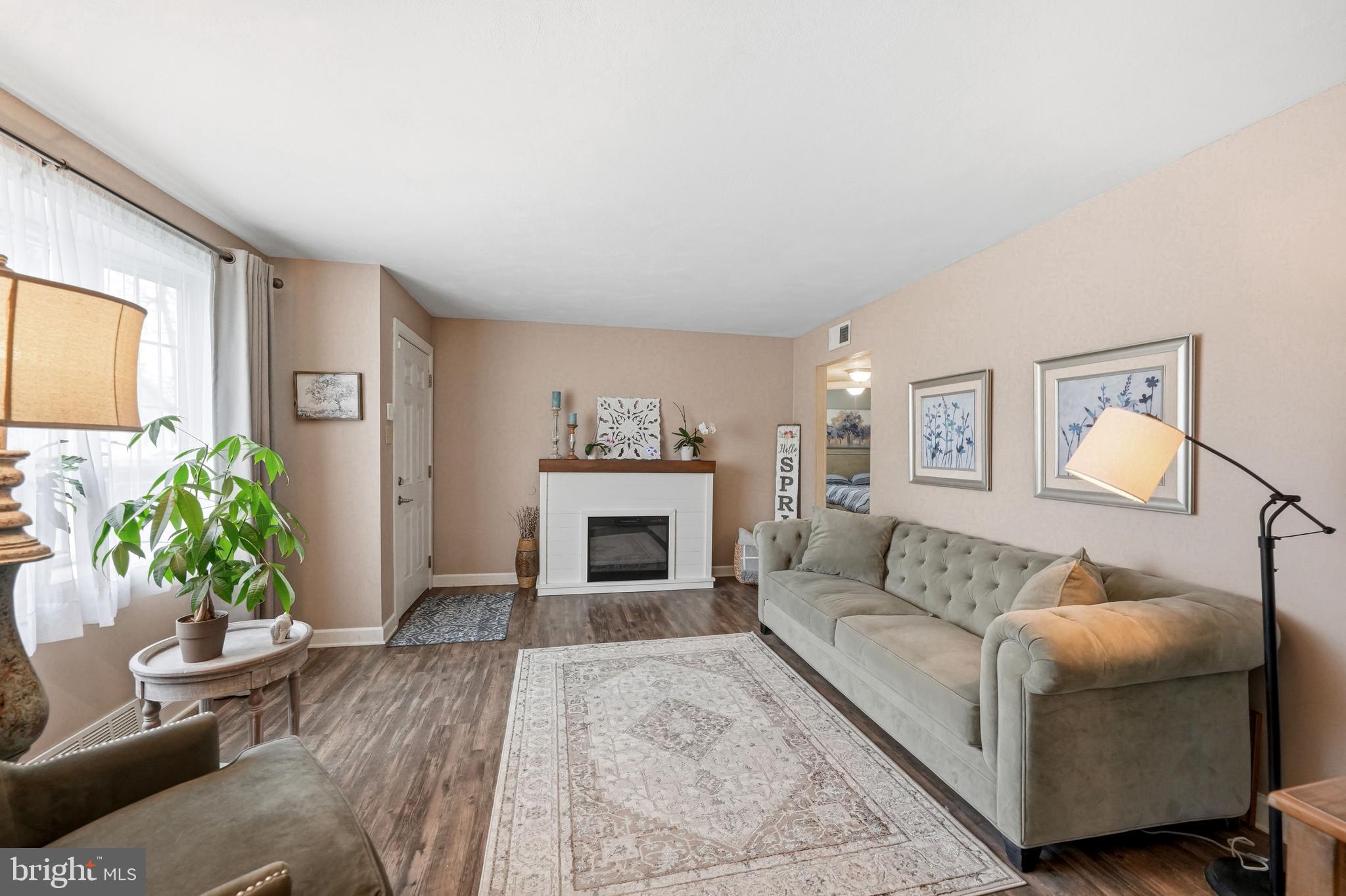 6 Woodbine Avenue Maple Shade, NJ 08052 - Photo 3 of 35 a living room with furniture and a fireplace