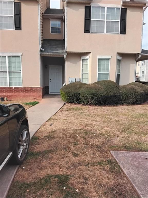 2390 Coach Way Jonesboro, GA 30236 - Photo 1 of 15 a front view of a house with a yard