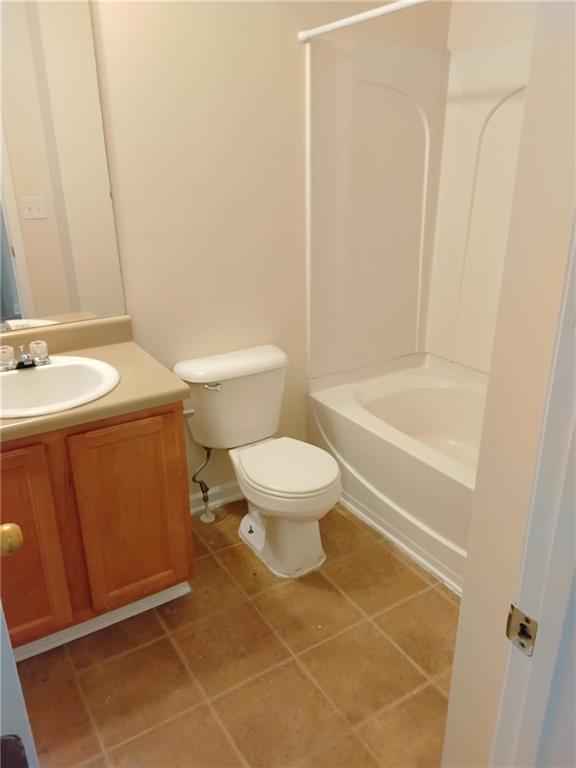 2390 Coach Way Jonesboro, GA 30236 - Photo 11 of 15 a bathroom with a toilet a sink and a bathtub