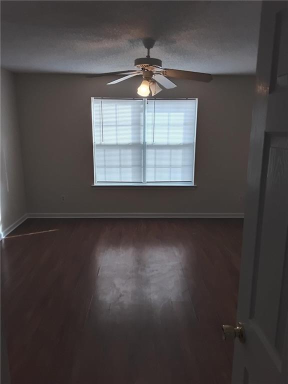 2390 Coach Way Jonesboro, GA 30236 - Photo 2 of 15 an empty room with wooden floor and windows