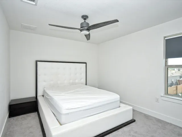 a room with a bed and a window