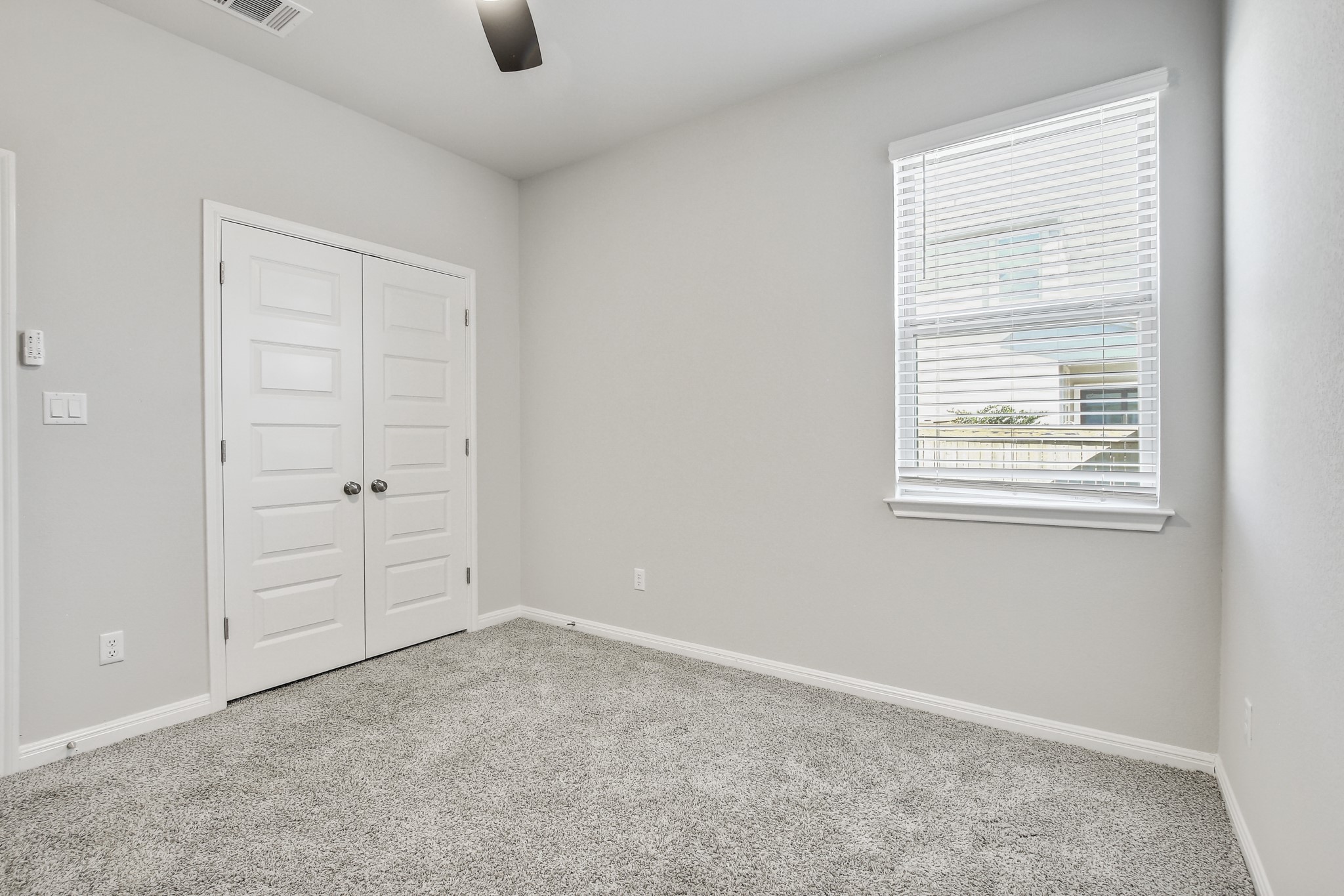 1220 Oak Chase Way Leander, TX 78641 - Photo 9 of 14 an empty room with windows and closet