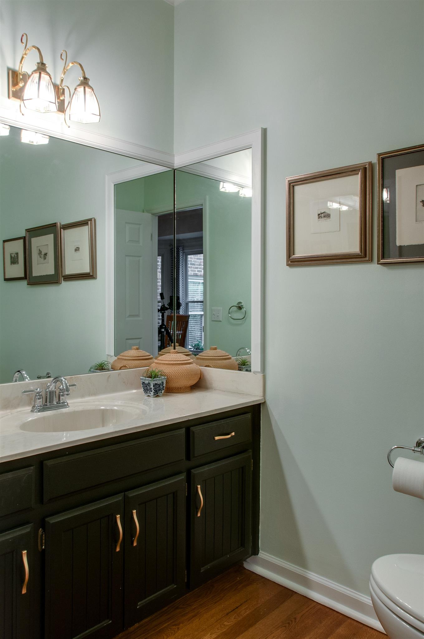 211 Mockingbird Road Nashville, TN 37205 - Photo 6 of 29 a bathroom with a granite countertop sink a toilet and a mirror
