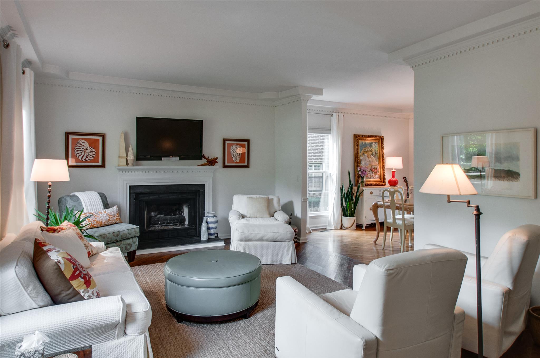 211 Mockingbird Road Nashville, TN 37205 - Photo 8 of 29 a living room with furniture a flat screen tv and a fireplace