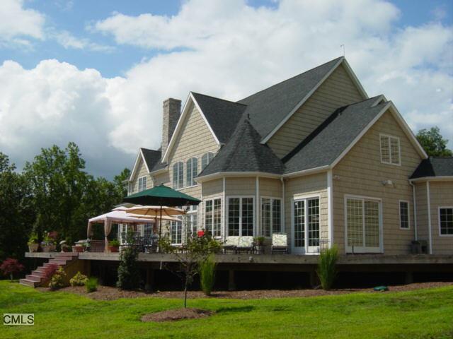 76 Walnut Tree Hill Road Newtown, CT 06482 - Photo 1 of 1 a front view of house with yard and green space