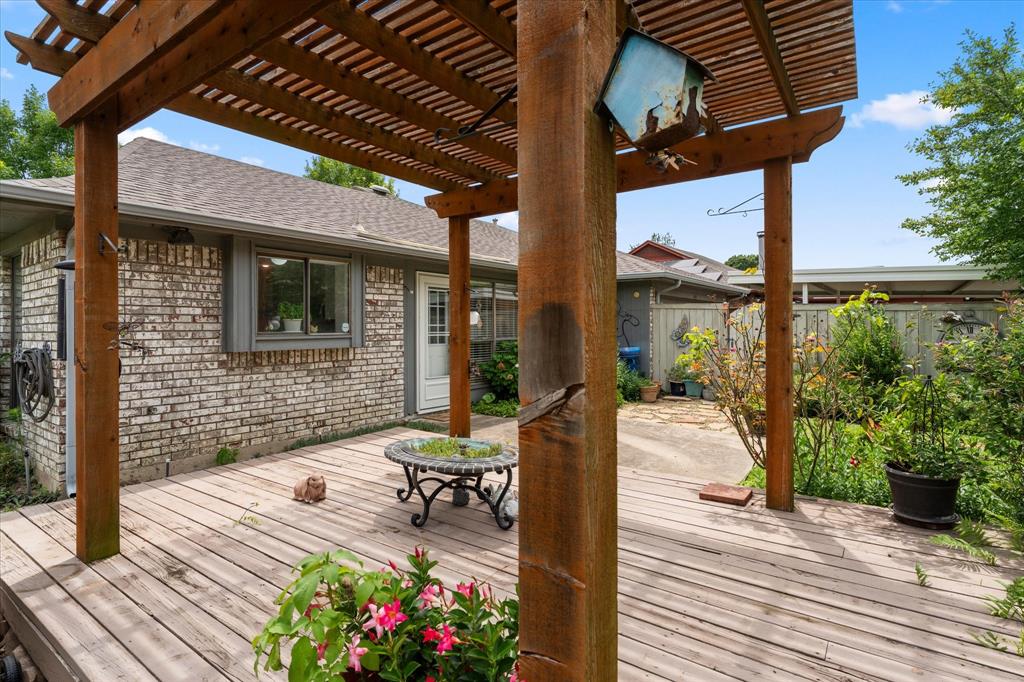 821 Baxter Drive Plano, TX 75025 - Photo 13 of 29 Whether hosting summer barbecues, enjoying morning coffee, or simply unwinding with a book, this outdoor space caters to various lifestyles.