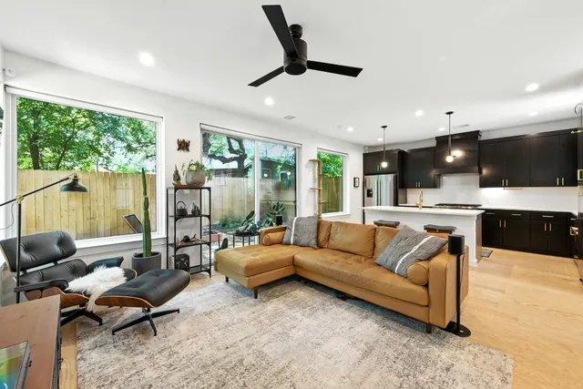 a living room with furniture and a large window
