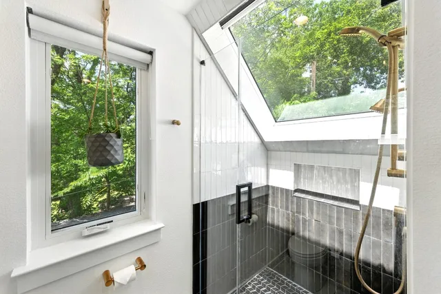 a view of living room with furniture and a window