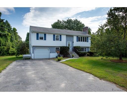 67 Ferry Road Salisbury, MA 01952 - Photo 1 of 25 a front view of a house with a garden and trees