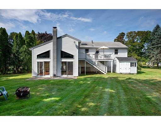 67 Ferry Road Salisbury, MA 01952 - Photo 18 of 25 a front view of a house with a yard table and chairs