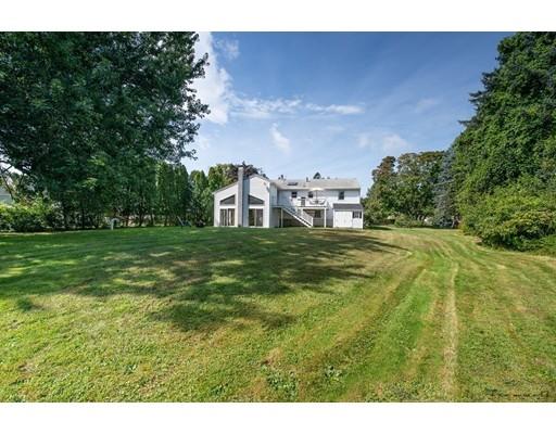 67 Ferry Road Salisbury, MA 01952 - Photo 25 of 25 a backyard of a house with lots of green space