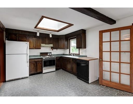 67 Ferry Road Salisbury, MA 01952 - Photo 5 of 25 a kitchen with stainless steel appliances granite countertop a refrigerator a sink dishwasher a stove and a microwave oven