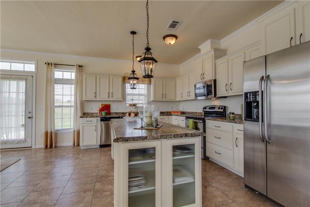 120 Piney Road Dickson, TN 37055 - Photo 6 of 20 SS appliances, awesome island w/ glass front cabinets, copper fixtures, upgrade countertops are just a few of the upgrades.