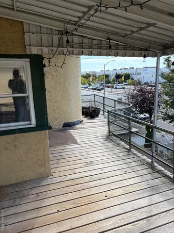a view of a terrace with wooden floor
