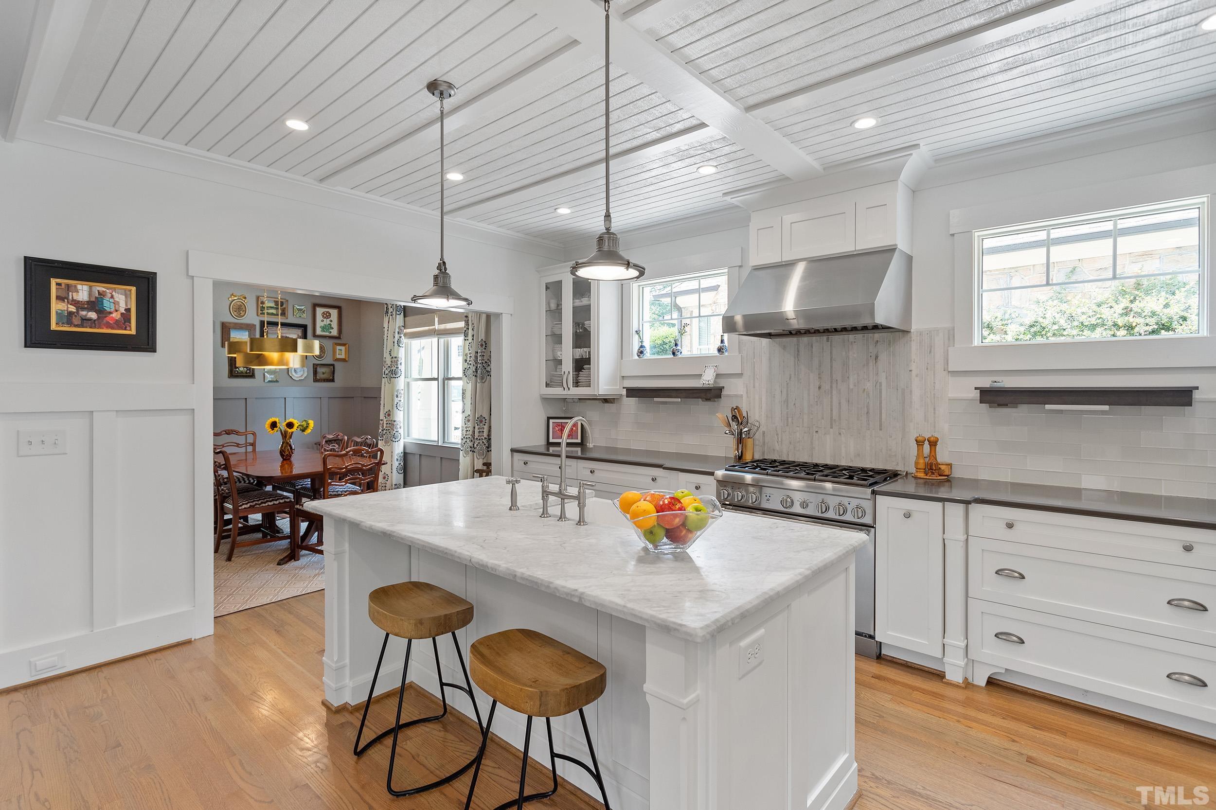2511 Beechridge Road Raleigh, NC 27608 - Photo 14 of 45 a kitchen with stainless steel appliances granite countertop a sink a stove and a wooden floors