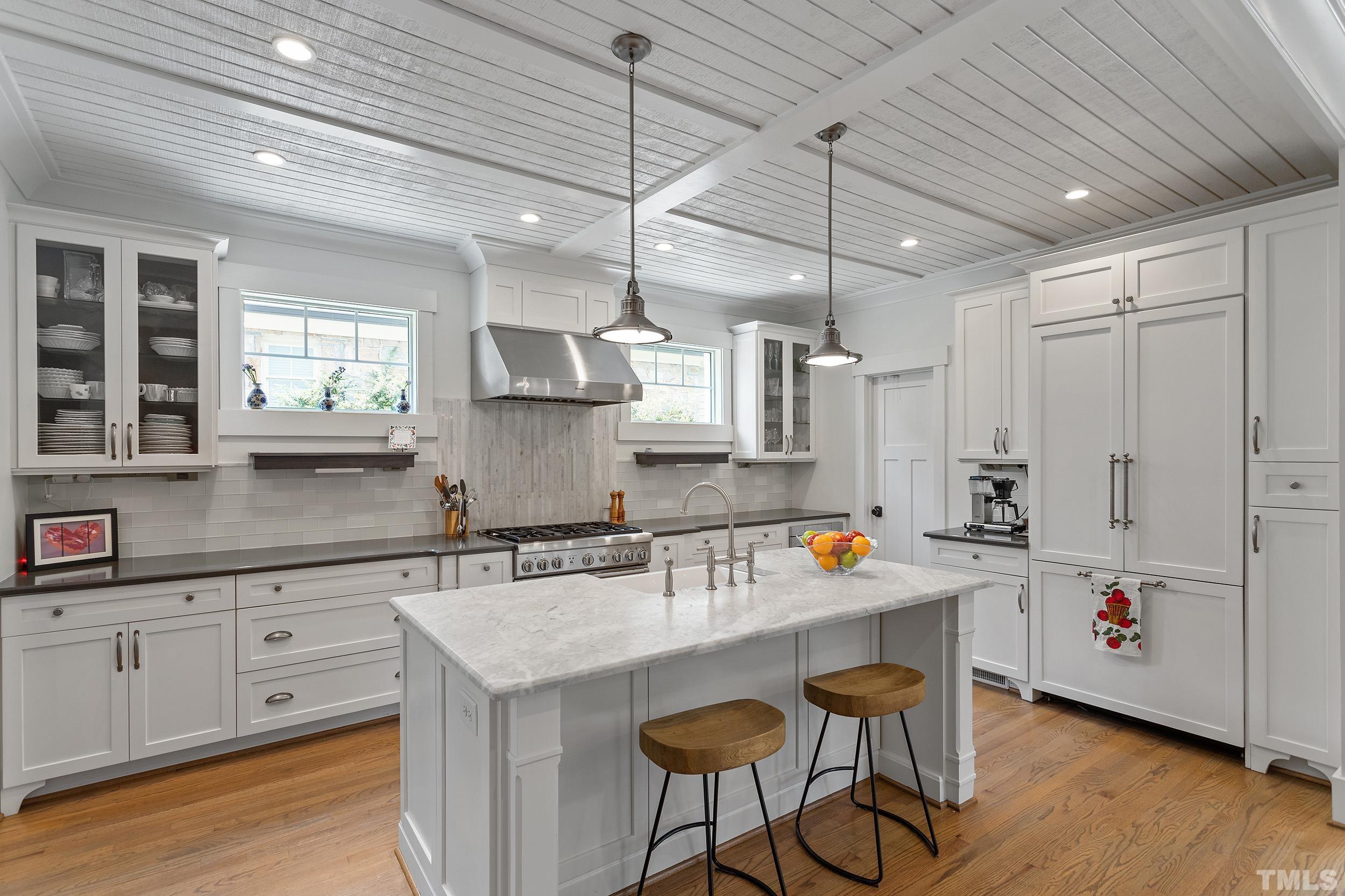 2511 Beechridge Road Raleigh, NC 27608 - Photo 15 of 45 a kitchen with stainless steel appliances granite countertop a sink and cabinets
